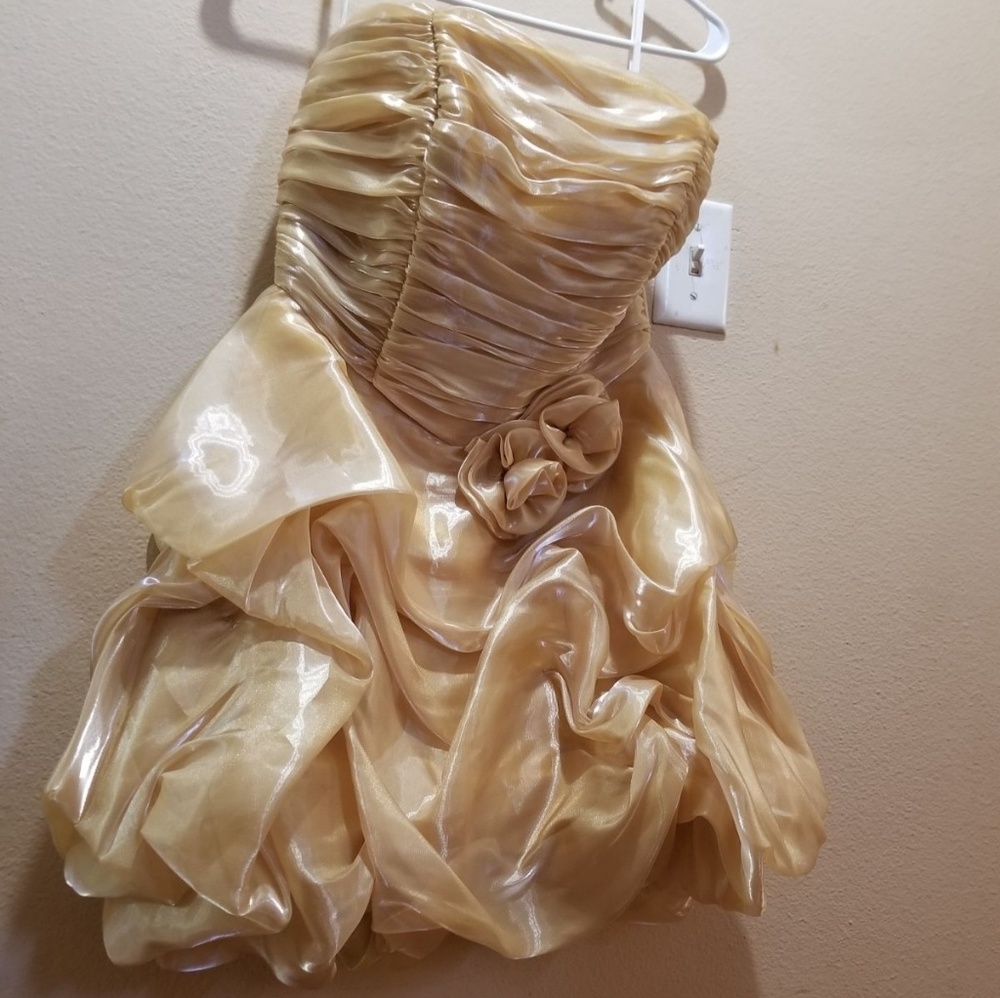available beautiful new gold color dress is for an